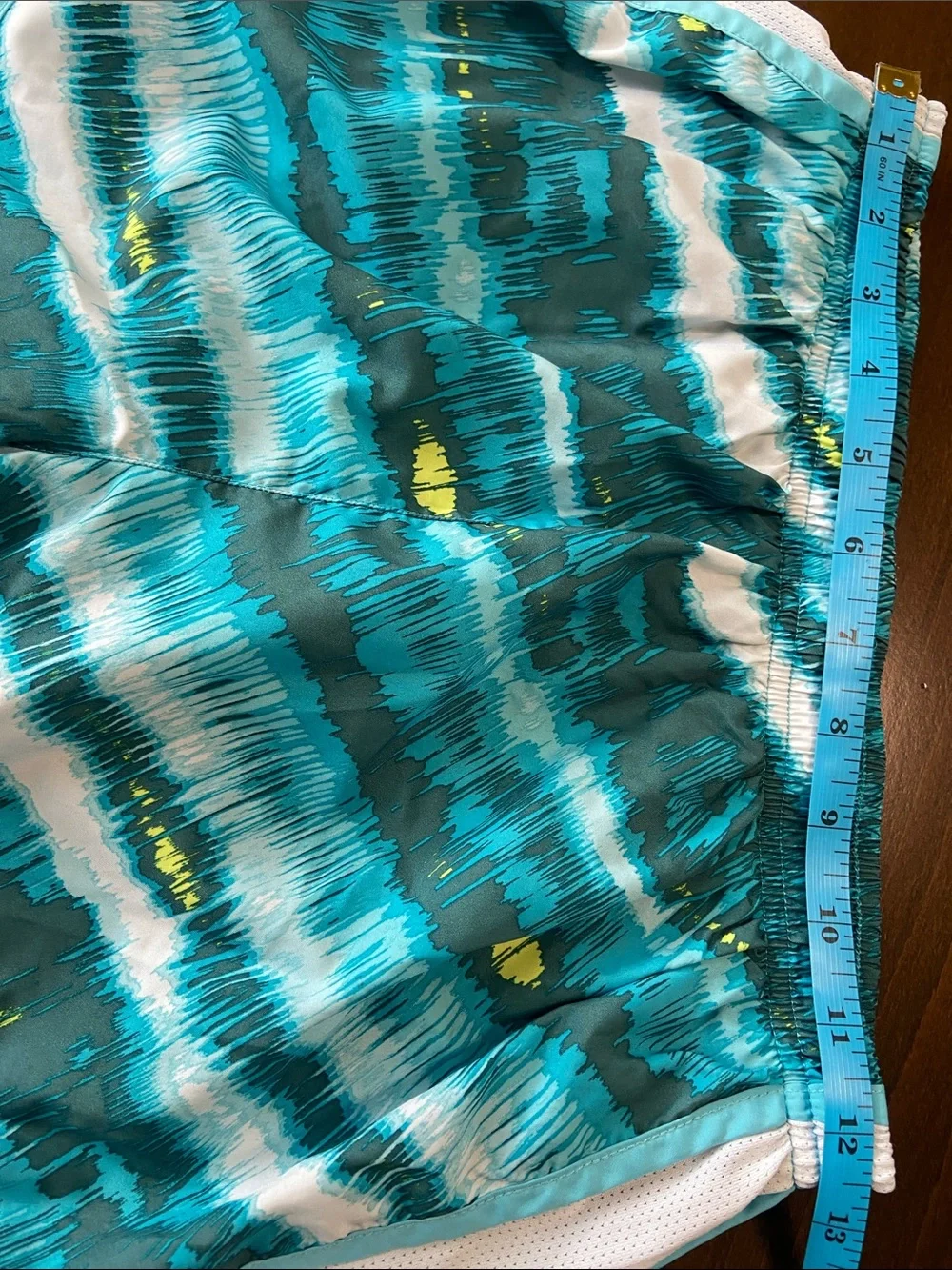 Nike Teal, White and Yellow Patterned Women’s Athletic Shorts. Size M